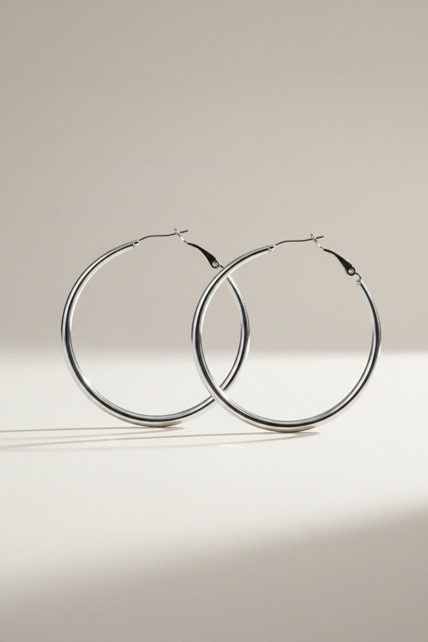 Nouvél the Label® zilverkleurige large curve hoop oorbellen van stainless steel met kliksluiting